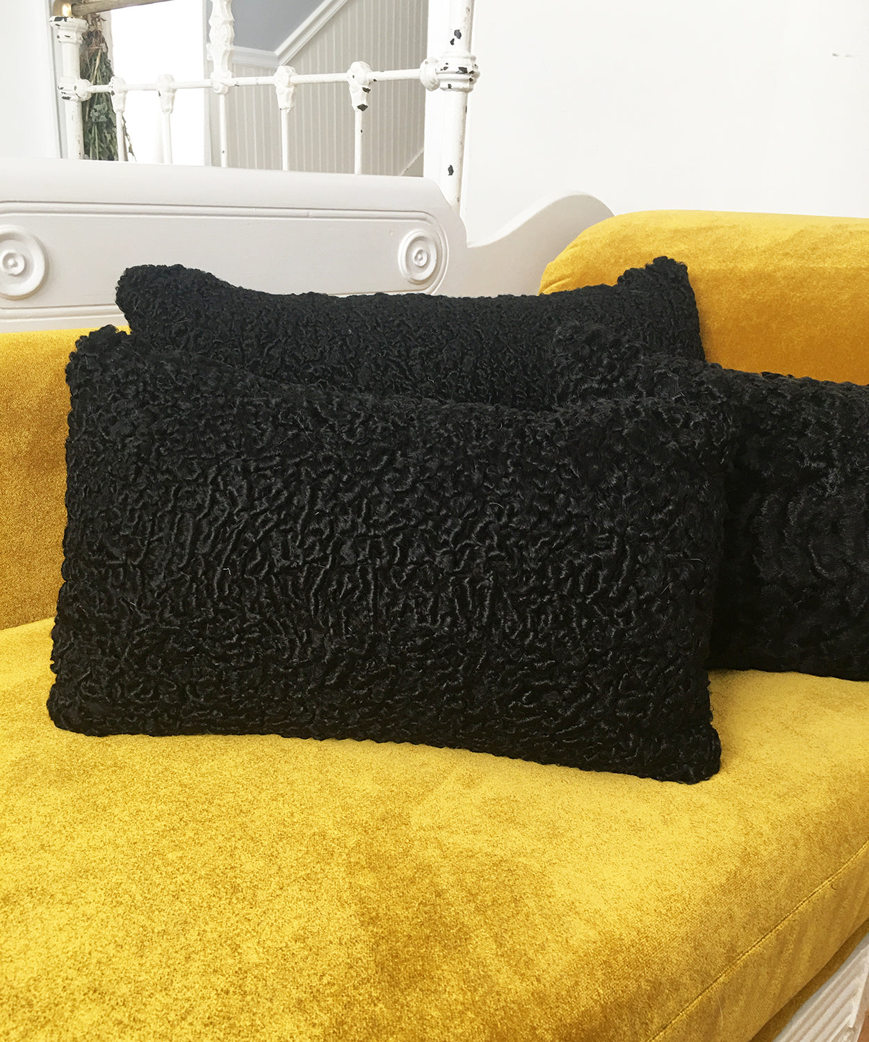 black Persian lamb fur pillow made from vintage fur coats. Cozy black furry pillow made in Canada