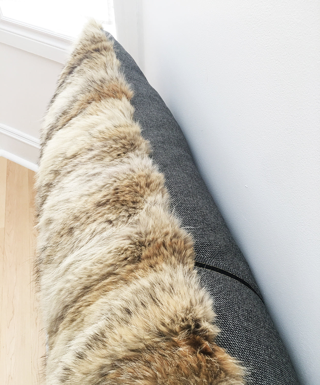 real fluffy coyote fur pillow made from vintage fur coats. Giant fur pillow made in Canada. Fur coat recycling idea. What should I do with my fur coat?